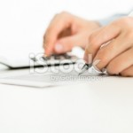 filling out tax forms on iStock